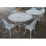 A pair of modern white painted metal circular garden table's,
