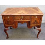 An 18th walnut lowboy, with three drawers about the shaped frieze on pad feet, 101cm x 105cm high.