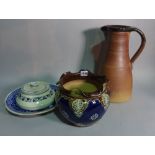 A Doulton jardinèire with blue glaze, 21cm high, a brown glaze studio pottery jug,