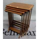 A Regency style mahogany nest of four tables on ring turned supports,