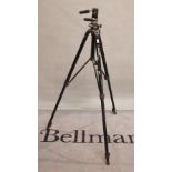 A mid 20th century ManFrotto professional camera tripod, 96cm tall.