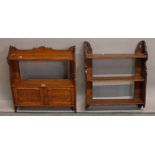 A 19th century oak hanging wall shelf with cupboard base,