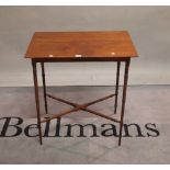 A William IV mahogany occasional table on ring turned supports united by an X frame stretcher,
