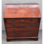 A George II inlaid walnut bureau, the fall over four long graduated drawers on bracket feet,