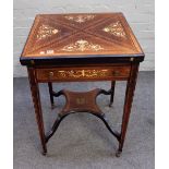 An Edwardian marquetry inlaid mahogany and rosewood envelope card table on tapering square supports,