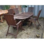 Royal Craft; a teak oval extending garden table, 100cm wide x 168cm long with two extra leaves,