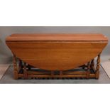 An 18th century style fruitwood double gate leg action wake table, 175cm long x 76cm high.