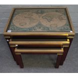 A nest of three campaign style brass bound mahogany occasional tables, with inset map tops,