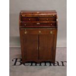 A 19th century mahogany cylinder bureau with cupboard drawer base on bracket feet,