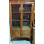 A 19th century mahogany display cabinet on tapering square supports, 95cm wide x 187cm high.