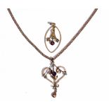 A gold, seed pearl and mauve paste set pendant detailed 9ct,