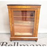 A late Victorian inlaid walnut pier cabinet on turned supports, 80cm wide x 105 high.