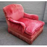 Howard and Sons, a later pink upholstered easy armchair on turned mahogany supports,