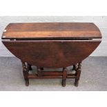 A late 17th century style oak gateleg table, with hinged circular top, end drawer,