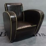 A mid 20th century leather upholstered low armchair, 78cm wide x 79cm high.