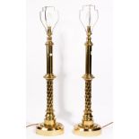 A large pair of modern gilt bronze table lamps, of columnar form, 68cm high, with shades.