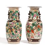 A pair of Chinese crackle glazed baluster vases, late 19th century, painted with battle scenes,