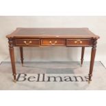A modern stained beech writing desk, inset leather top over three freize drawers, on reeded,