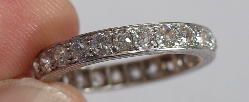 A platinum and diamond set full eternity ring, mounted with cushion shaped diamonds, - Image 5 of 6