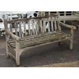 A modern hardwood garden bench 122cm wide x 84cm high.