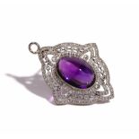 A diamond and amethyst pendant brooch, in a pierced shaped oval quatrefoil design,
