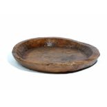 A large dugout hardwood circular shallow bowl, 54cm diameter x 9cm high.