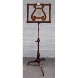 A late 19th century mahogany height adjustable music stand,