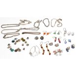 A group of mostly silver mounted jewellery, comprising; twelve pairs of earrings, nine bracelets,