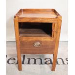 A George III mahogany tambour fronted commode on square supports,