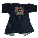 A Chinese embroidered surcoat, late 19th century, of dark navy satin,