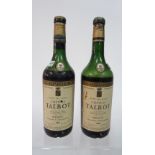 Two bottles of Chateau Talbot Medoc 1961 (at shoulder).