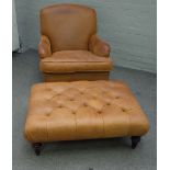 A 20th century brown leather upholstered easy armchair, on turned supports, 78cm wide x 88cm high,
