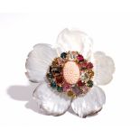 A carved coral, diamond and varicoloured gemstone set brooch, of flowerhead design,