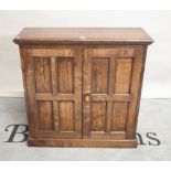 An 18th century style oak two door side cupboard on plinth base, 86cm wide x 85cm high.