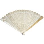 A Chinese ivory brisé fan, 19th century, carved and pierced with pagodas, birds and flowers,