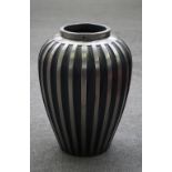 A Modern polished steel ribbed baluster vase, 61cm high.