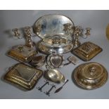 Silver plated wares including; a pair of candlesticks, a galleried oval tray, entrèe dishes,