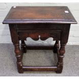 An oak joint stool, 17th century, the rectangular top with stepped moulded edge, having wavy aprons,