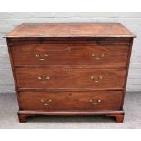 A George III mahogany chest, the brushing slide over three long graduated drawers on bracket feet,