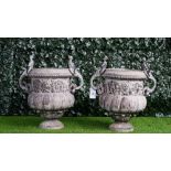 A pair of lead urns, in Louis XIV arabesque style,