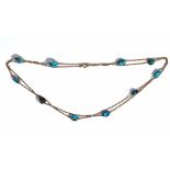 A gold and turquosie matrix long chain,
