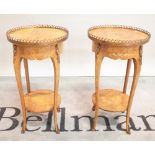 A pair of 20th centuary kingwood and marquetry inlaid circular two tier occasional tables with