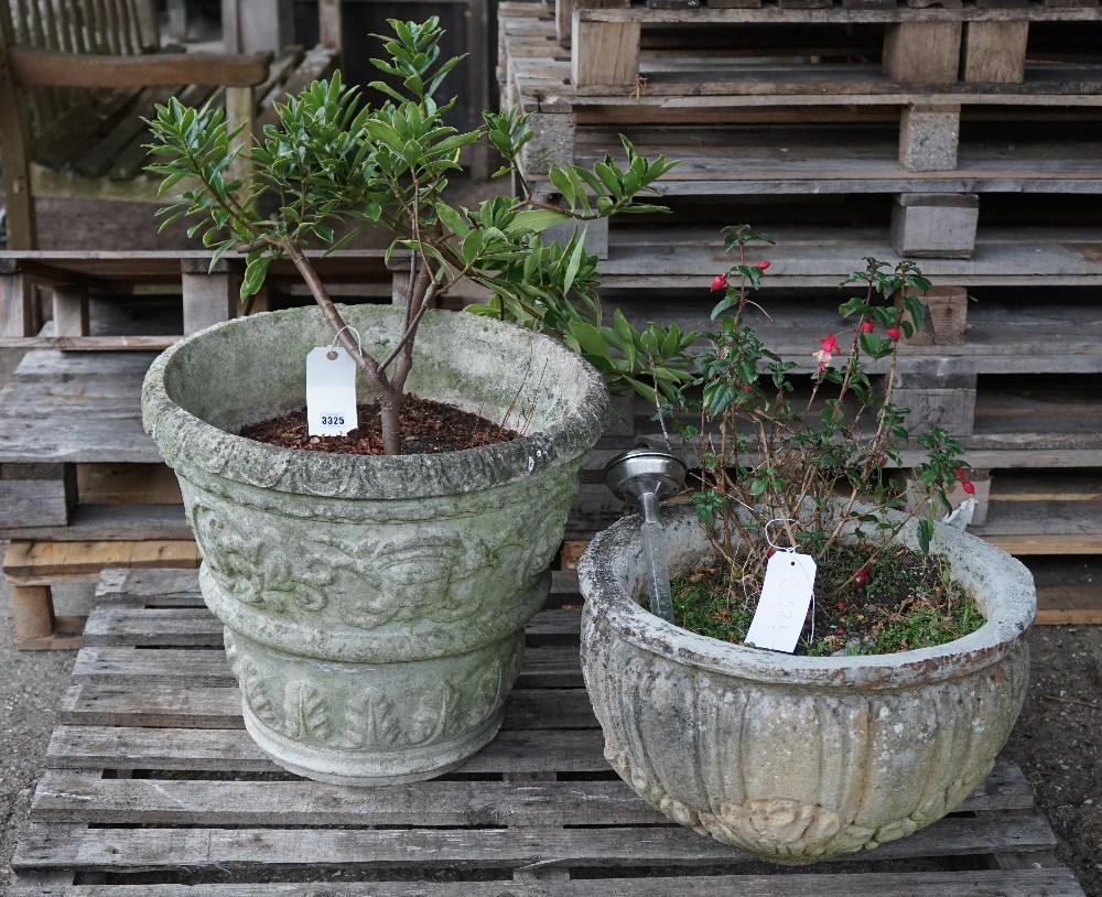 An early 20th century reconstituted stone circular planter with egg and dart decoration,