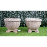 A pair of reconstituted stone circular jardinieres,