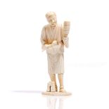 A Japanese ivory sectional okimono of a musician, Meiji period,