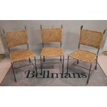 A set of seven modern wrought iron and rattan dining chairs, 44cm wide x 91cm high.