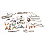A group of mostly silver mounted jewellery, comprising; twelve pairs of earrings, nine bracelets,
