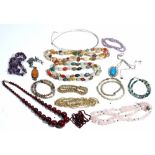 A single row necklace of varicoloured agate beads, seven further bead necklaces,