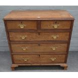 A George III oak mahogany crossbanded chest, with two short and three long drawers,