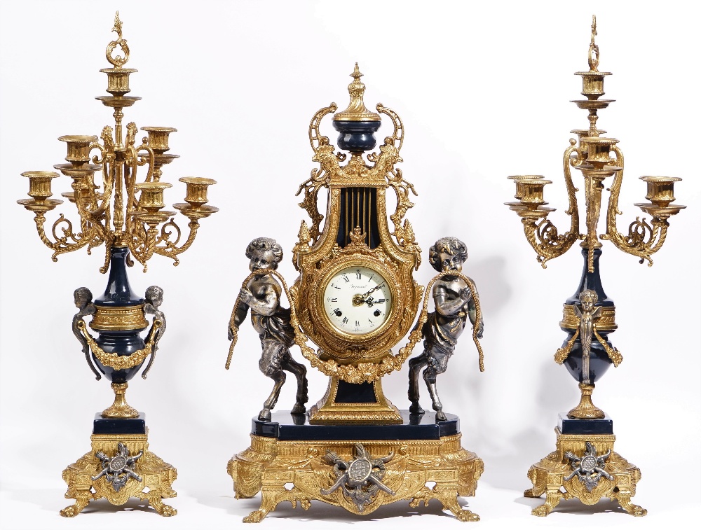 An Louis XVI style gilt metal mounted clock garniture, 20th century,
